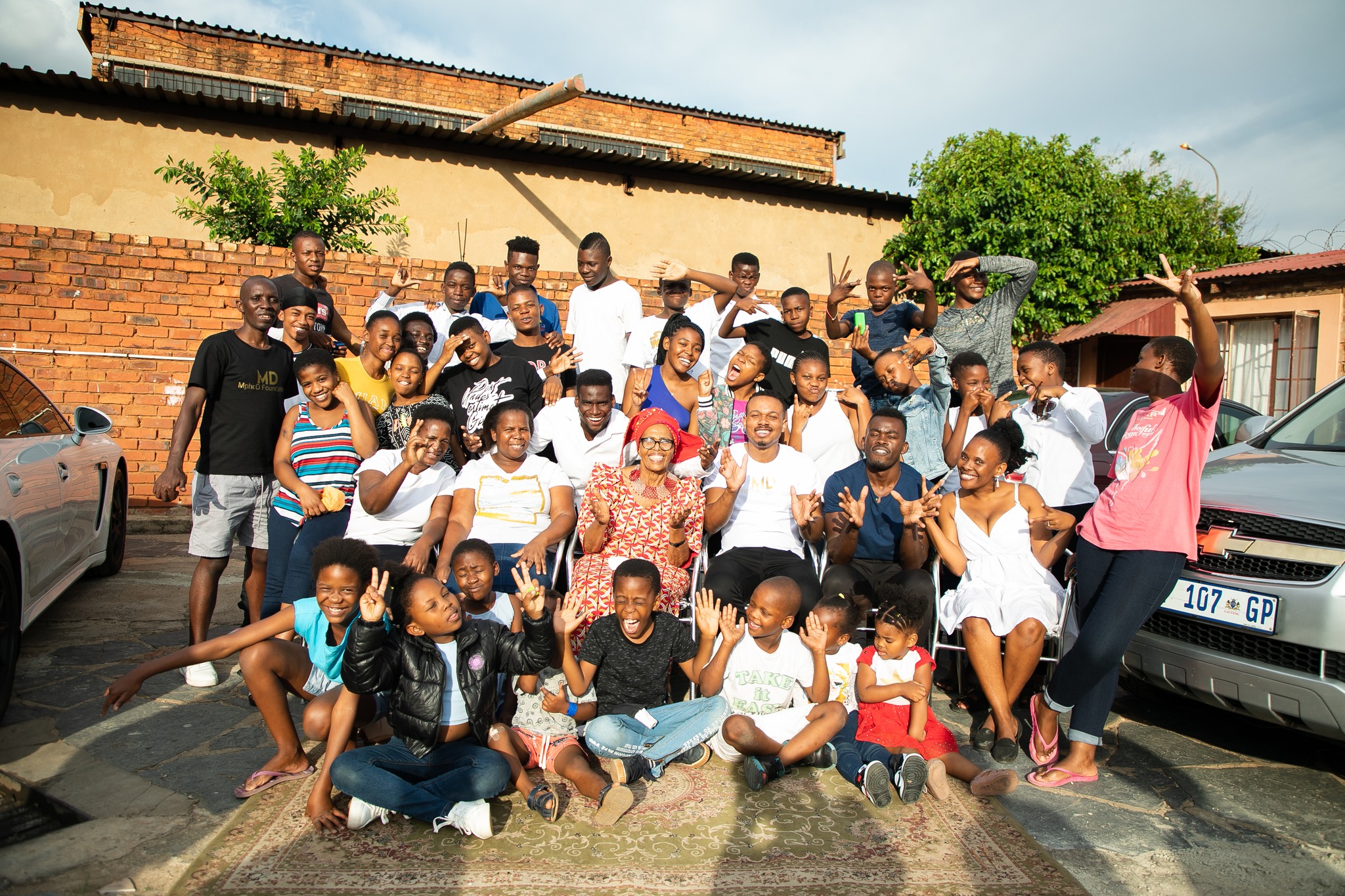 The Gift Foundation team with children at a partner home